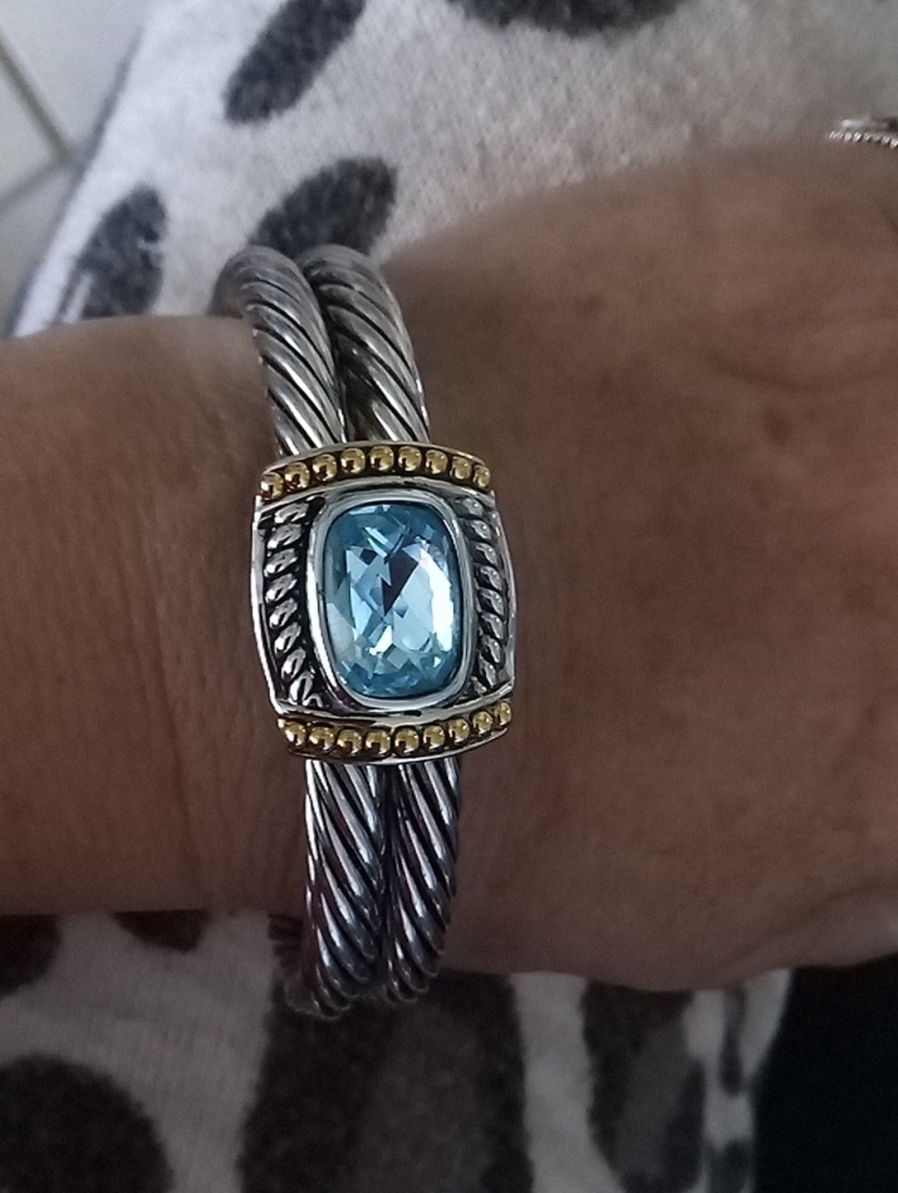 Silver Cable Bangle with Light Blue Stone and Gold Accents